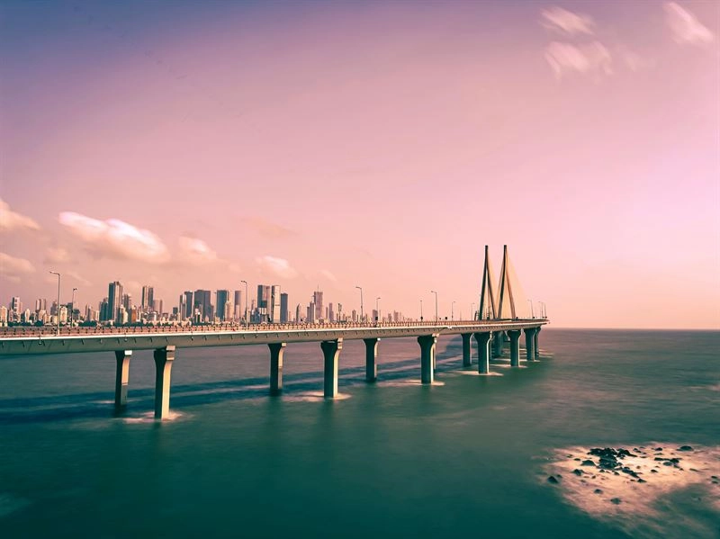 A view of the Bandra-Worli Sea Link in Mumbai, connecting the city with a backdrop of modern skyscrapers and a vibrant skyline.